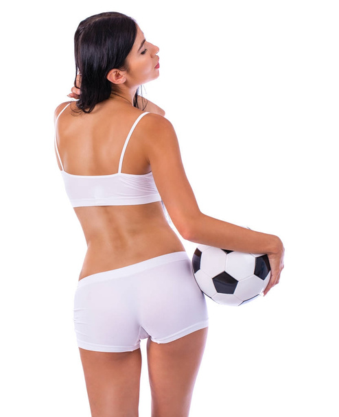 Young beautiful woman in white fitness clothing - Foto, Imagen
