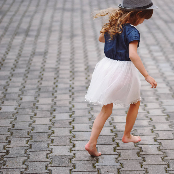 little beautiful barefoot girl in park - Фото, зображення