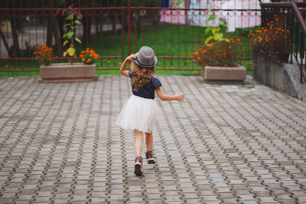 young happy girl running away - Foto, Imagen