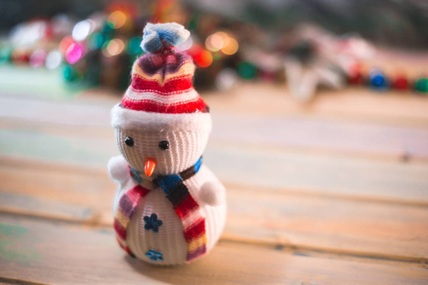 Snowman on a wooden background. New Year's still life. - Foto, Imagem