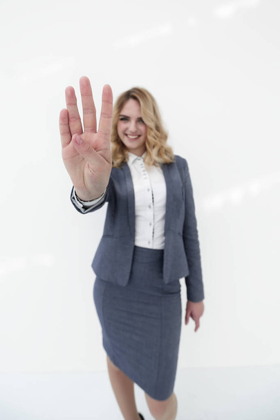 Smiling business woman showing stop sign to the camera - Фото, зображення
