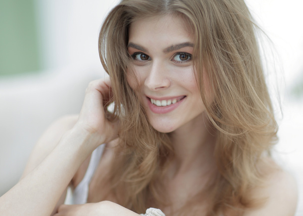 closeup portrait of a smiling young woman with light make-up - 写真・画像