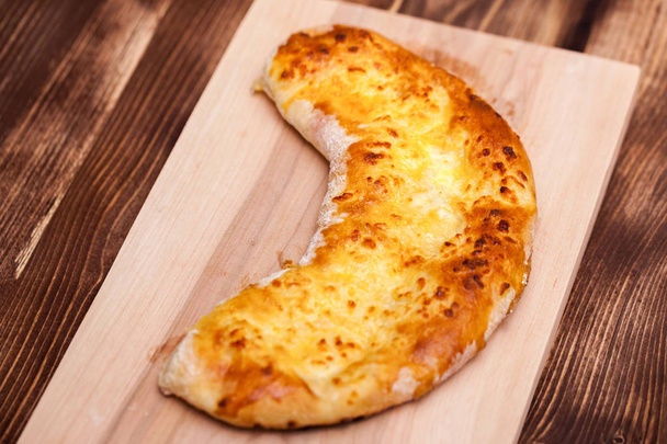khachapuri (ghvezeli) in a half moon form for christmas day, Geo - Photo, Image