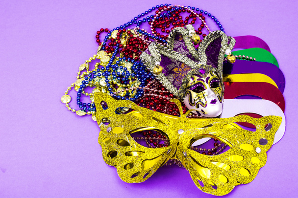 Celebration of mardi gras. Venetian, carnival, masquerade mask, beads - Photo, Image