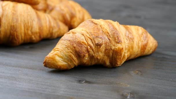 Delicious croissants on a piece of old wood - Footage, Video
