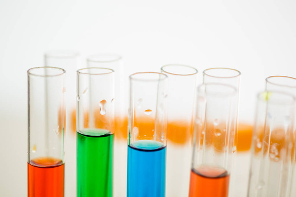 Colorful test tubes in holder - Fotó, kép