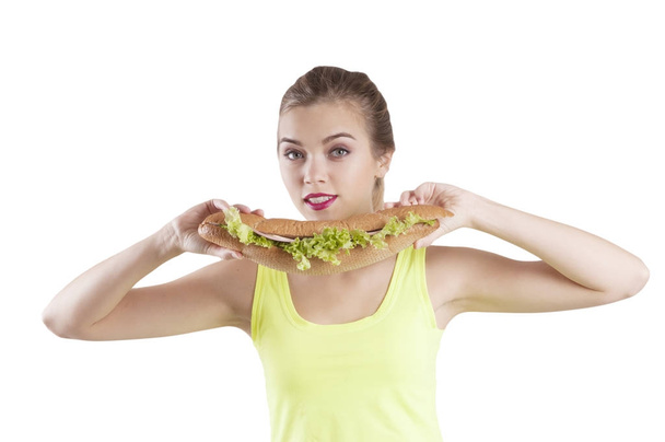 sport meisje met een geïsoleerde sandwich-portret - Foto, afbeelding