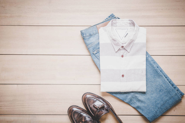 Clothing for men on the wooden background - 写真・画像