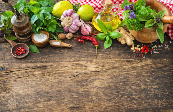 Fresh herbs and spices on wooden table - Fotoğraf, Görsel