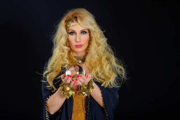 Woman fortune teller with crystal ball portrait - Foto, imagen