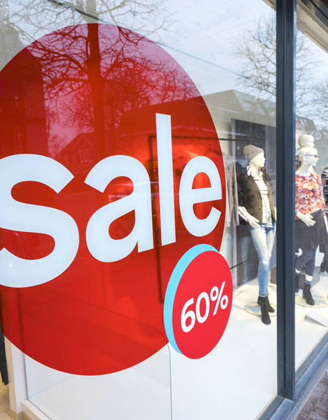 the word sale in shopping window during winter sale time - Photo, Image