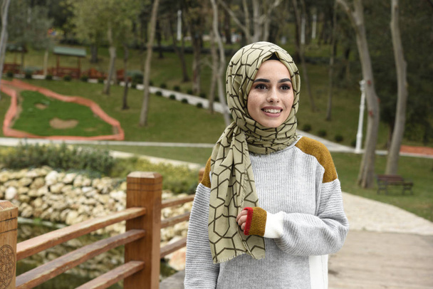 beautiful young muslim woman in nature - Photo, Image