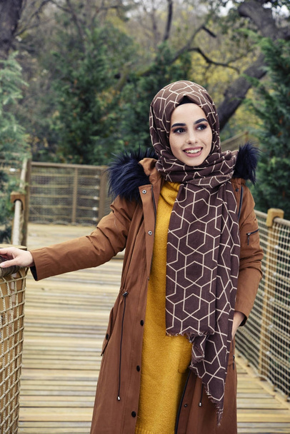 beautiful young muslim woman in nature - Photo, Image