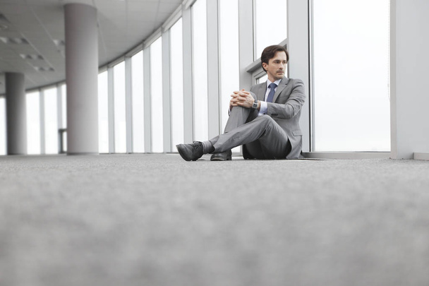 Businessman sitting on floor - 写真・画像