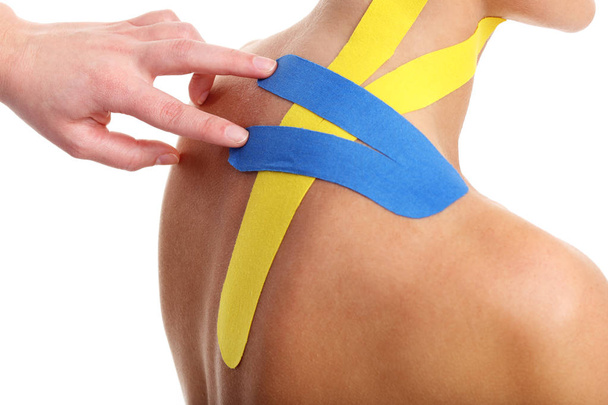 Picture showing special physio tape put on injured back over white background - Fotografie, Obrázek