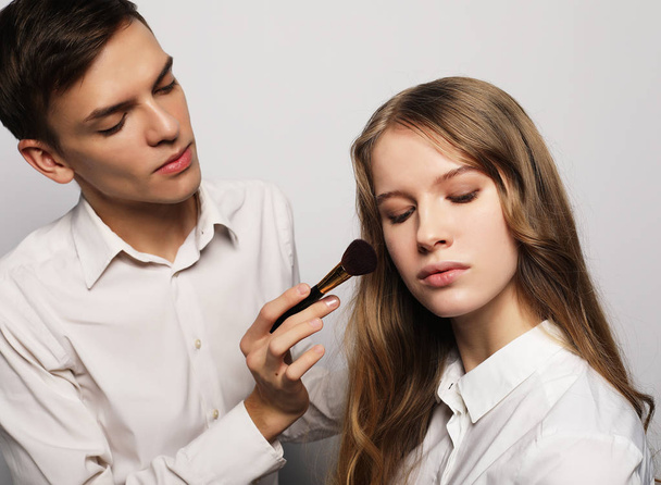Beauty concept: Make-up artist doing makeup - Fotó, kép