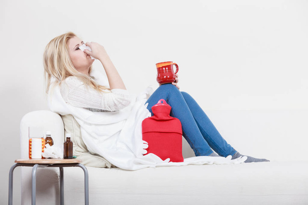 Woman being sick having flu lying on sofa - Foto, Imagem