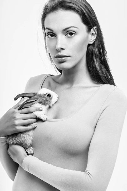 pretty woman with rabbit isolated - Fotó, kép