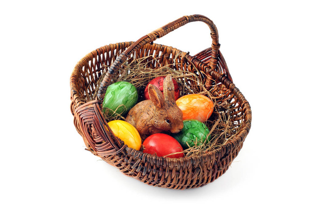 Easter egg basket with easter rabbit sitting in the nest - Photo, Image