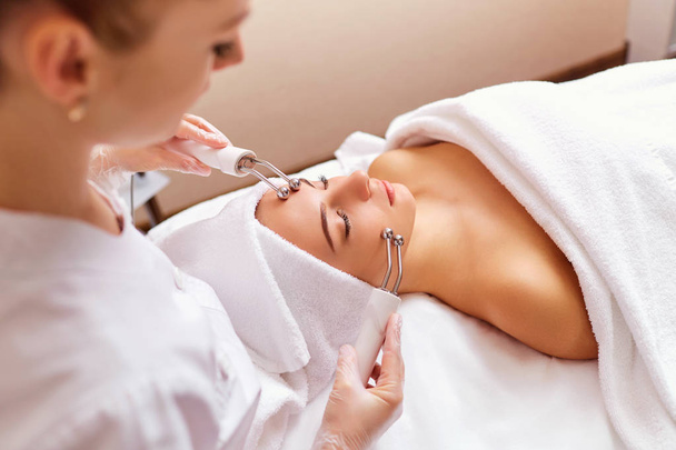 Woman on facial skincare procedure. - Photo, image