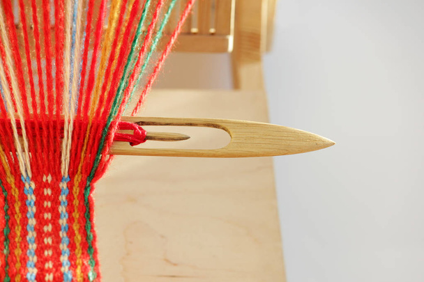 Weaving mini machine for making belts with patterns. Folk art, handmade. Detail - Photo, Image
