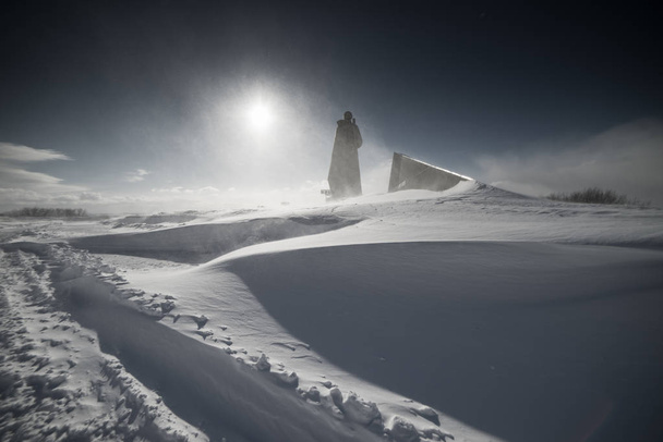 in the far cold north, a tall monument against the background of white snow - Photo, image