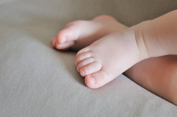 Close up of newborn baby feet - Fotó, kép