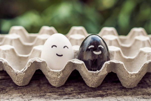 interracial marriage concept. Black and white egg as a pair of d - Foto, Bild
