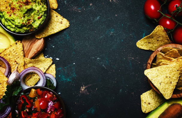 Tex-Mex Concept, Nachos, Guacamole, Salsa Sauce, Black Background, Top View - Фото, изображение