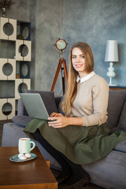 Friendly Young Woman Student with Laptop at Home - Photo, Image