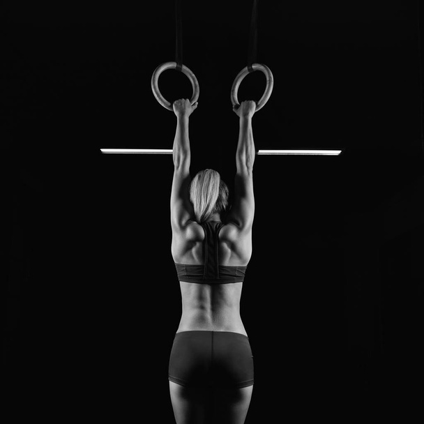 Female fitness athlete exercising - Фото, изображение
