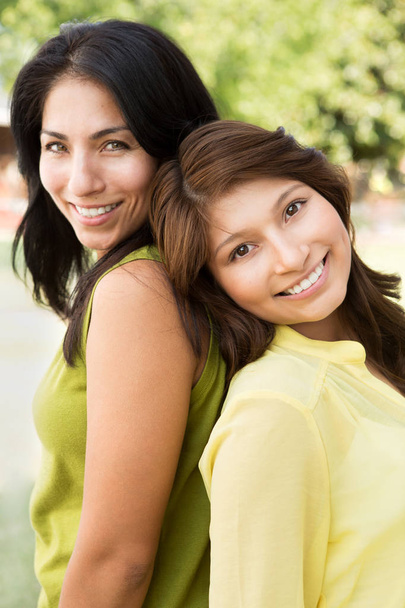 Hispanic mother and daughter. - Фото, зображення