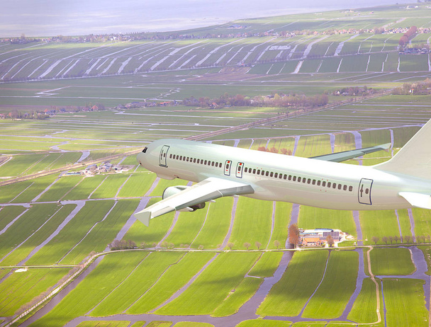 Wit 3d vliegtuigen vliegen boven Nederlands landsca - Foto, afbeelding
