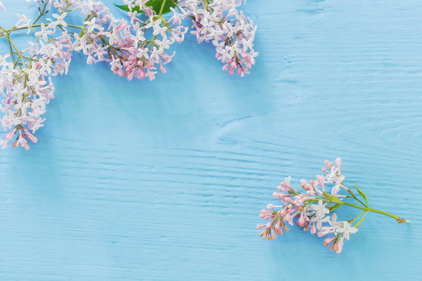The beautiful lilac on a blue wooden background - Φωτογραφία, εικόνα