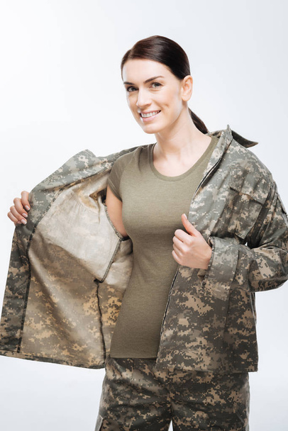 Happy glad woman wearing camouflage jacket - Foto, Imagen