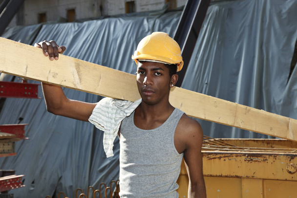 young african man working in construction site  - Photo, Image