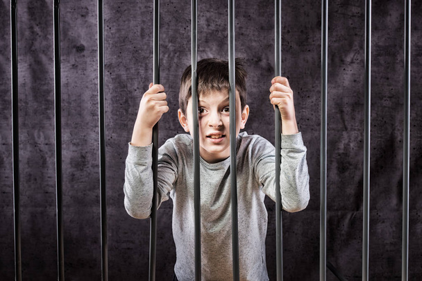 Boy in prison - Foto, immagini