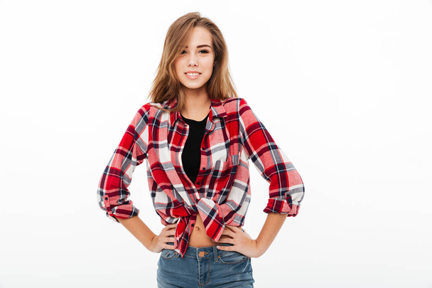 Portrait of a smiling casual girl in plaid shirt - Фото, зображення