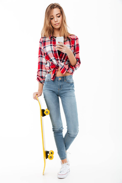 Full length portrait of a young pretty girl in plaid shirt - Foto, Imagem