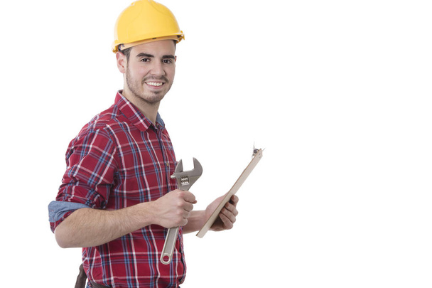 retrato de constructor profesional con herramienta y documentos
 - Foto, imagen