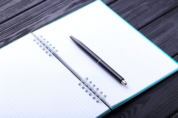 Notebook with pen on table - Fotografie, Obrázek