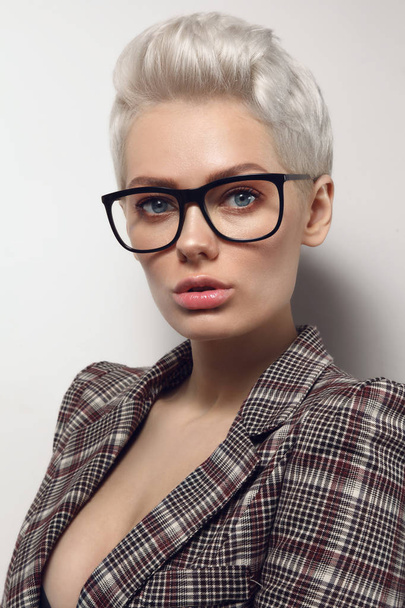 Portrait of young blond stylish woman in glasses - Фото, зображення