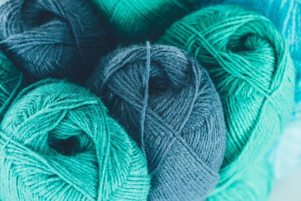 close up of blue and green knitting yarn balls - Foto, Imagen