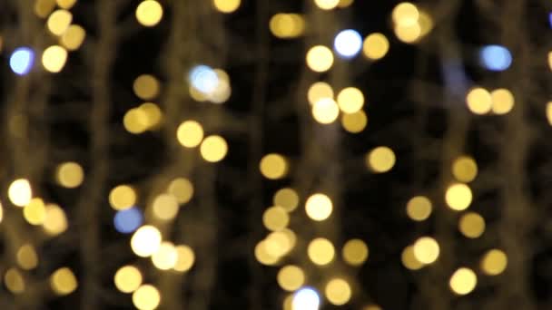 Golden glittering bokeh lights of Christmas decorations - Footage, Video