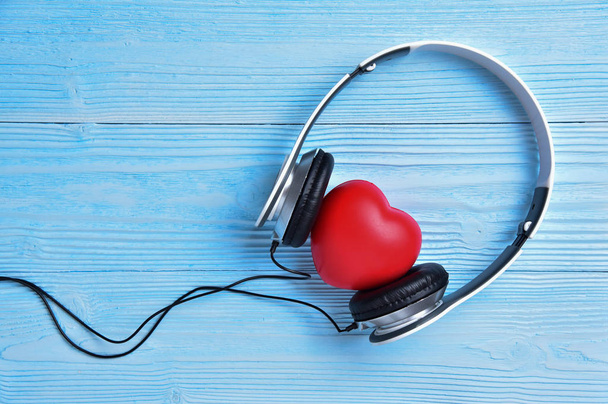 A white Headphone with a red heart. - Photo, Image