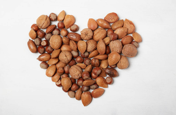 Heart made with nuts , healthy snack - Zdjęcie, obraz