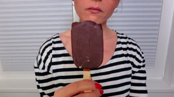 Woman dressed in striped dress with ice cream - Footage, Video