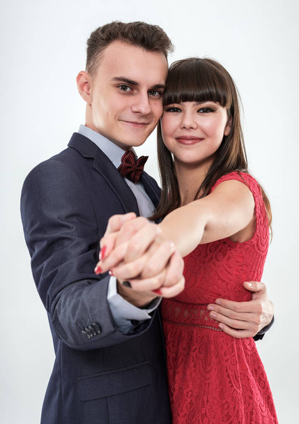 Beautiful couple of teenagers holding hands like dancing tango - Fotografie, Obrázek