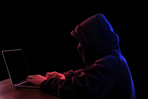 Anonymous hacker in the dark - Foto, Imagen