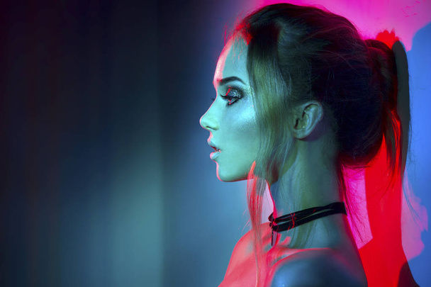woman with trendy make-up in colorful bright lights - Fotografie, Obrázek